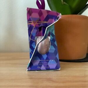 Fenty Beauty Gloss Bomb Crystal in holographic shine.